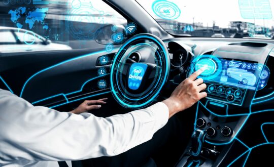 Self-drive autonomous car with man at driver seat.